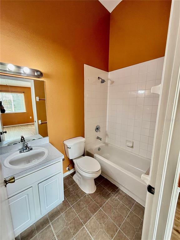 29920 Playa Del Rey Lane Wesley Chapel, FL 33543 - Photo 11 of 32 a bathroom with a sink a toilet and shower