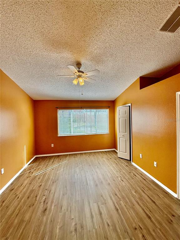 29920 Playa Del Rey Lane Wesley Chapel, FL 33543 - Photo 12 of 32 a view of an empty room with window