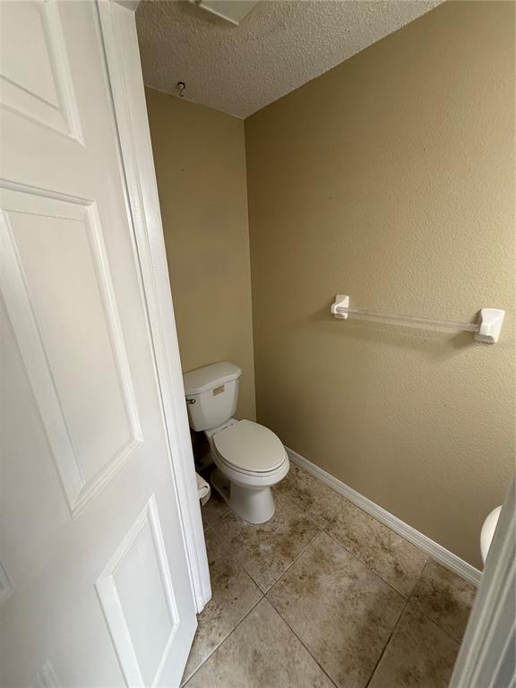 29920 Playa Del Rey Lane Wesley Chapel, FL 33543 - Photo 24 of 32 a white toilet sitting next to a sink