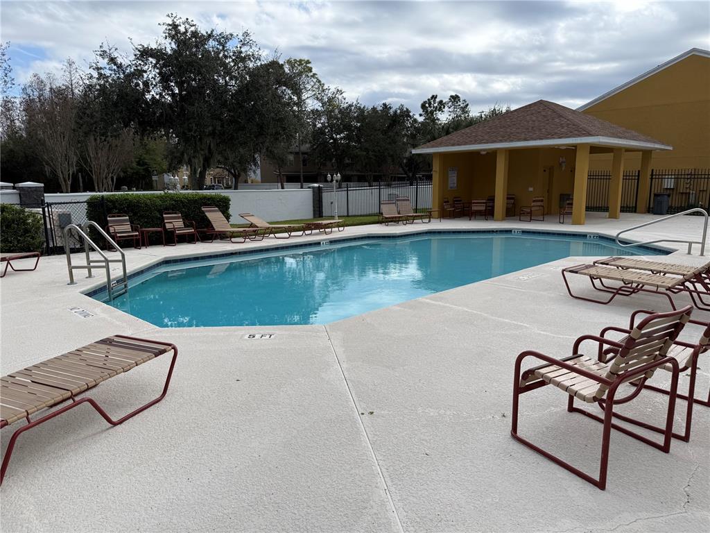 29920 Playa Del Rey Lane Wesley Chapel, FL 33543 - Photo 30 of 32 an outdoor space with swimming pool and furniture