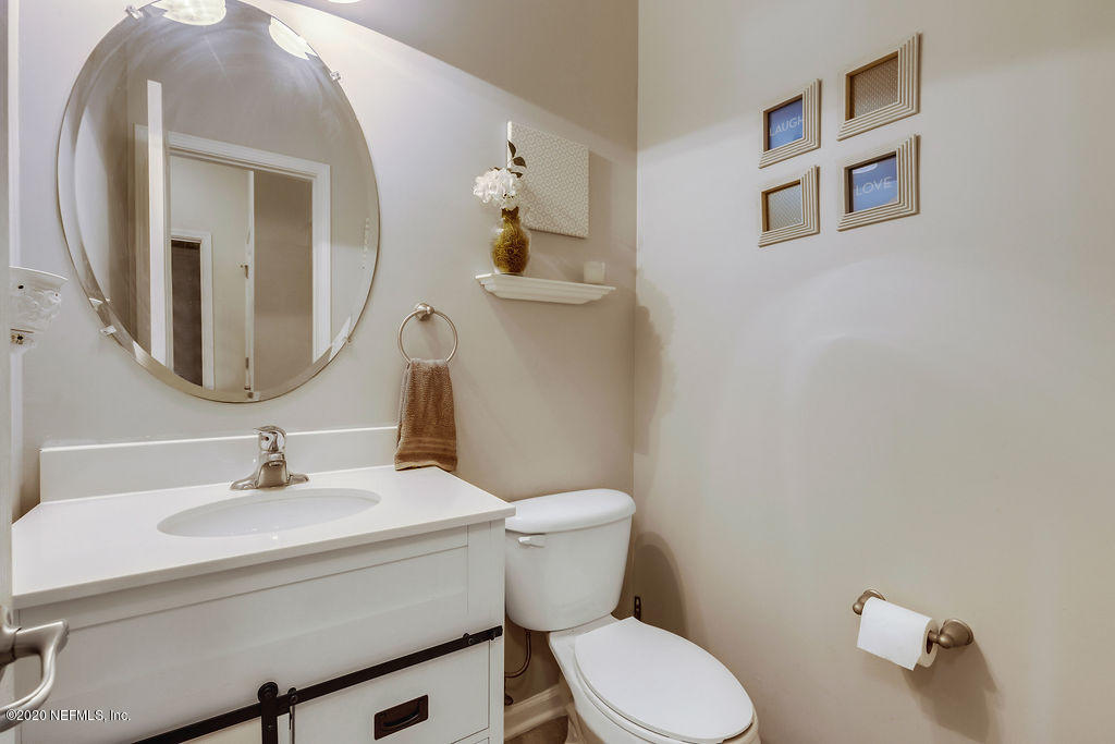1737 North Cappero Drive St. Augustine, FL 32092 - Photo 15 of 47 a bathroom with a toilet a sink and mirror