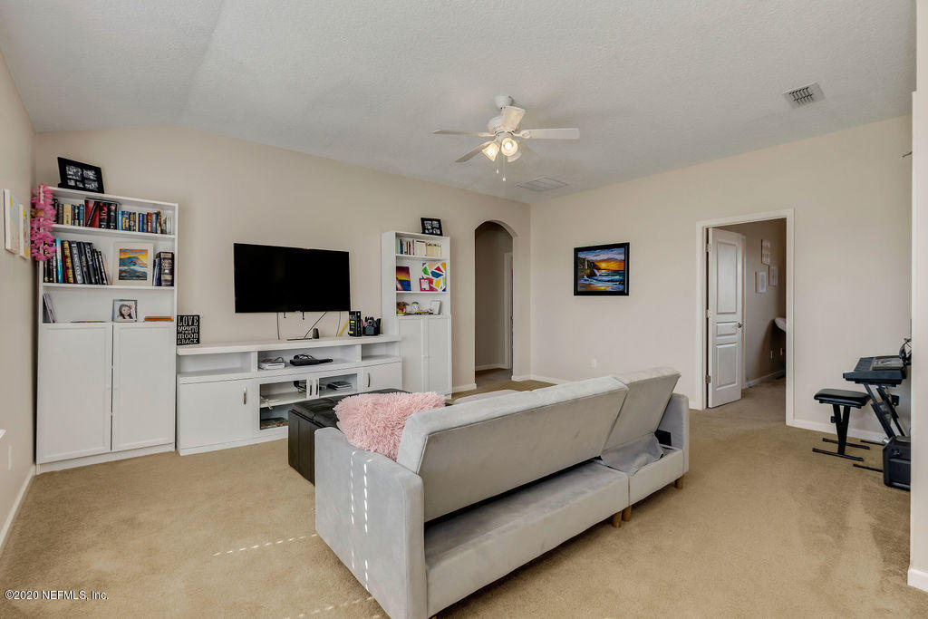 1737 North Cappero Drive St. Augustine, FL 32092 - Photo 22 of 47 a bedroom with a bed and a flat screen tv