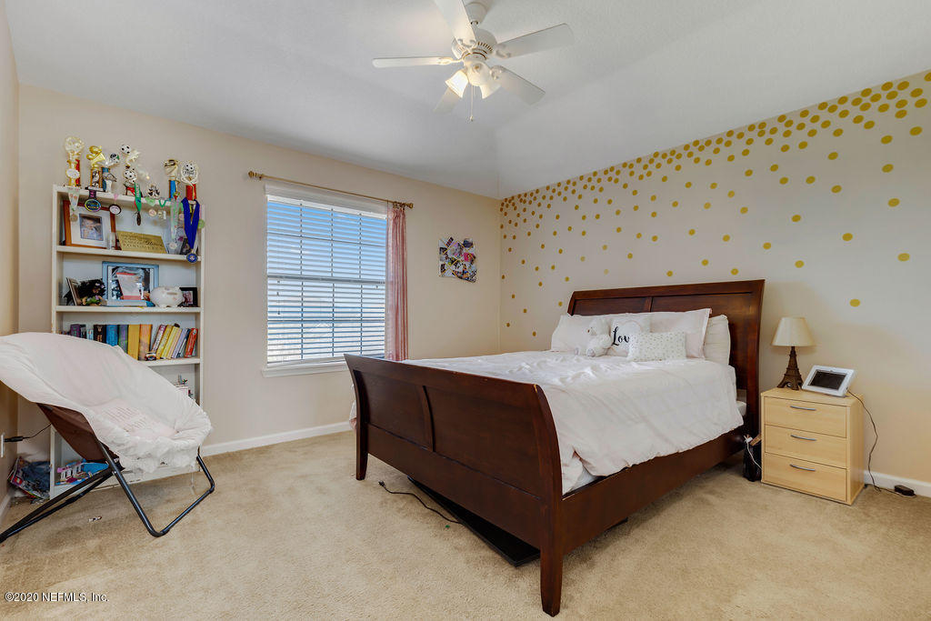 1737 North Cappero Drive St. Augustine, FL 32092 - Photo 24 of 47 a bedroom with a bed dresser and a window