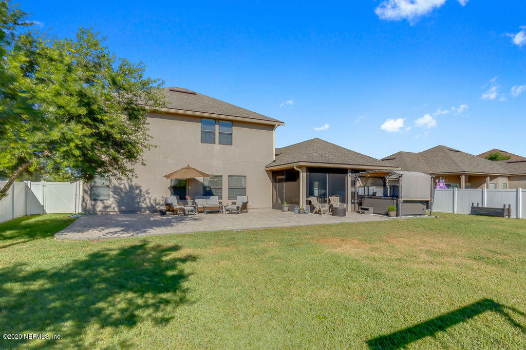 1737 North Cappero Drive St. Augustine, FL 32092 - Photo 34 of 47 a view of a house with a yard and sitting area