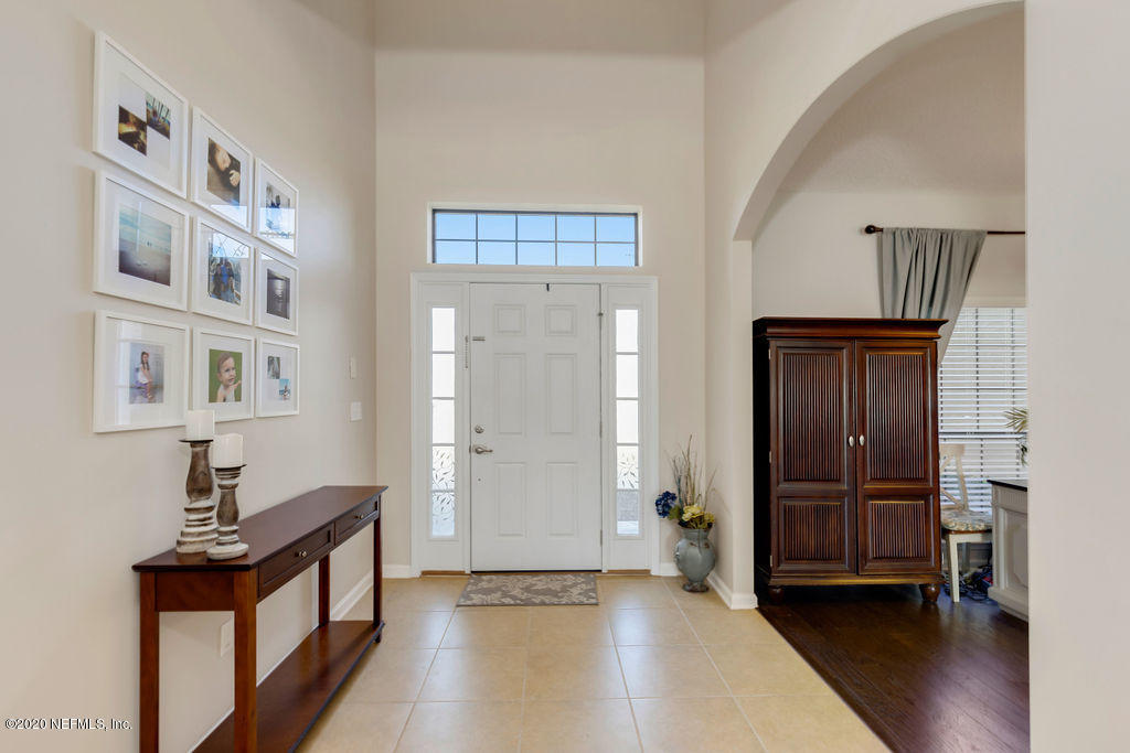 1737 North Cappero Drive St. Augustine, FL 32092 - Photo 4 of 47 a view of a hallway with wooden floor and entryway