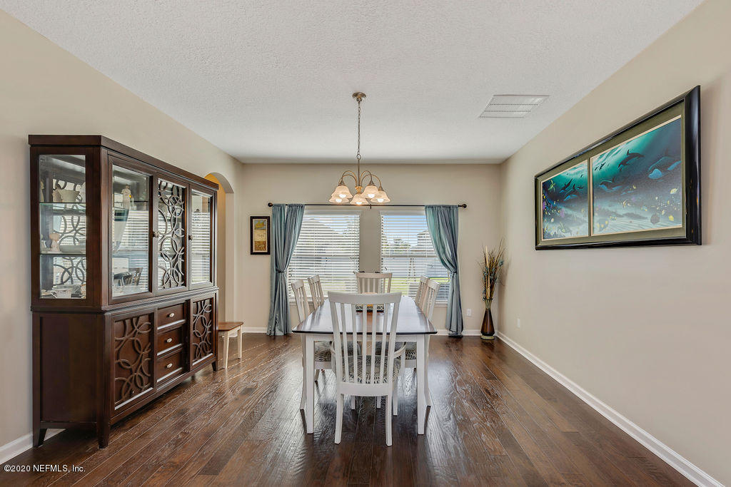 1737 North Cappero Drive St. Augustine, FL 32092 - Photo 5 of 47 a view of a dining room with furniture window and wooden floor