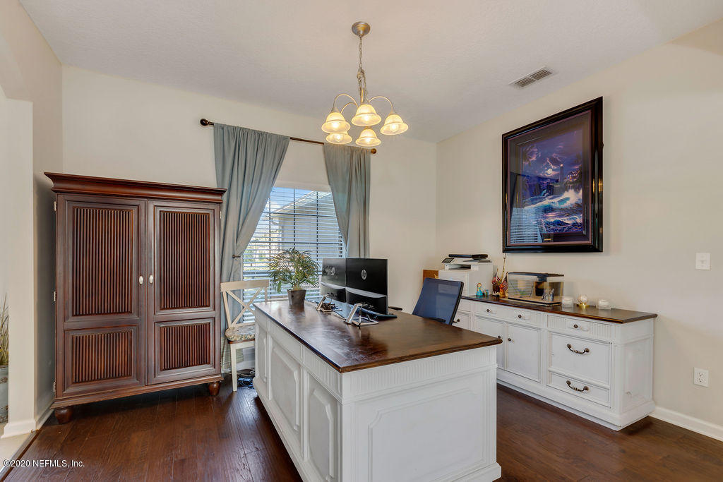 1737 North Cappero Drive St. Augustine, FL 32092 - Photo 7 of 47 a kitchen that has a lot of cabinets in it