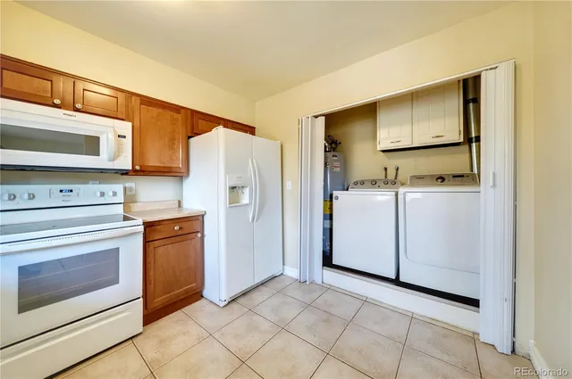 a kitchen with stainless steel appliances a stove a microwave and a refrigerator