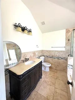 a bathroom with a sink and mirror
