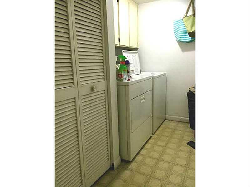 8509 Boca Rio Drive, Unit 8509 Boca Raton, FL 33433 - Photo 15 of 16 a bathroom with a sink and a mirror