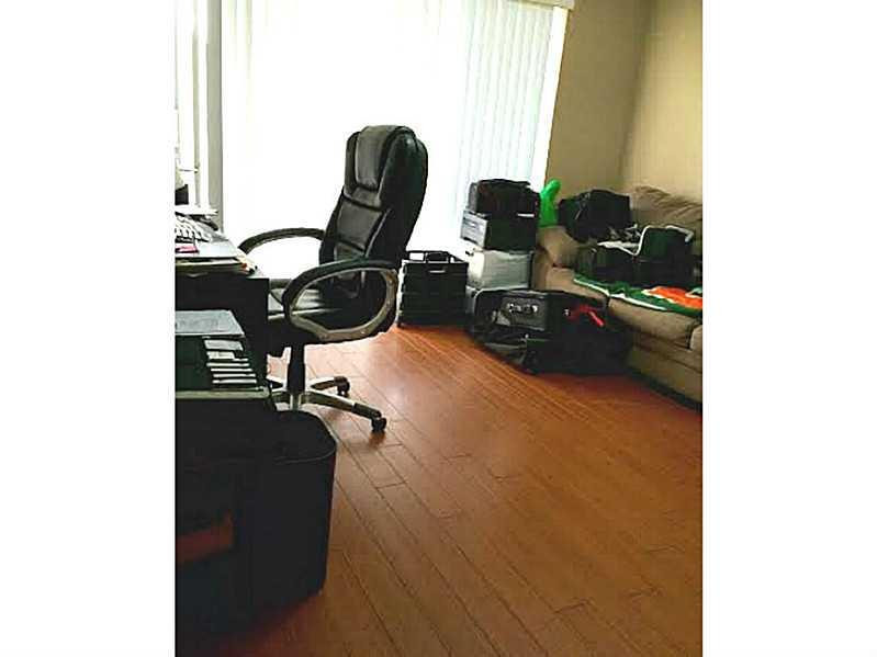 8509 Boca Rio Drive, Unit 8509 Boca Raton, FL 33433 - Photo 16 of 16 a view of a workspace with furniture and a window