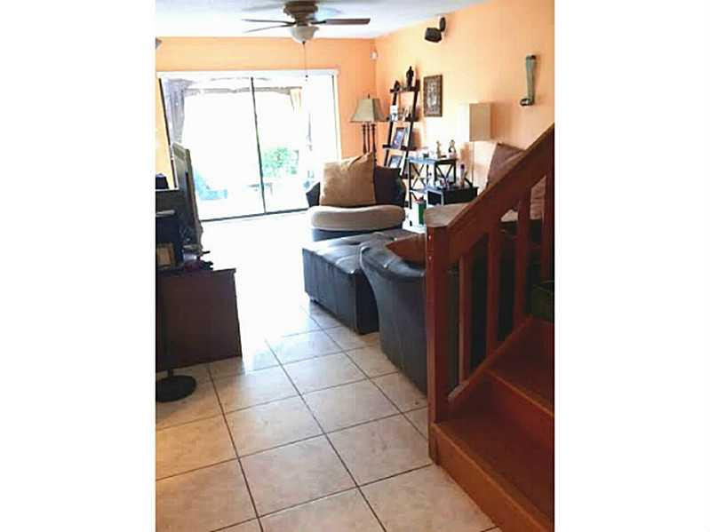 8509 Boca Rio Drive, Unit 8509 Boca Raton, FL 33433 - Photo 5 of 16 a living room with a sink and cabinets