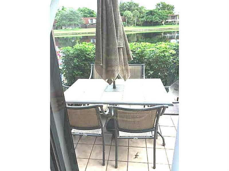 8509 Boca Rio Drive, Unit 8509 Boca Raton, FL 33433 - Photo 10 of 16 a dining room with a table and chairs
