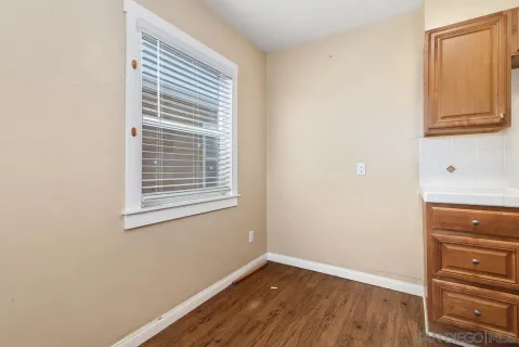a kitchen with a stove a refrigerator and a microwave