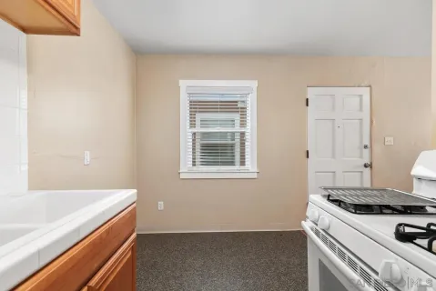 a kitchen with a stove and a sink
