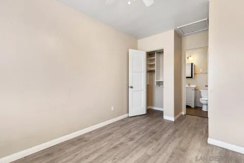 an empty room with wooden floor