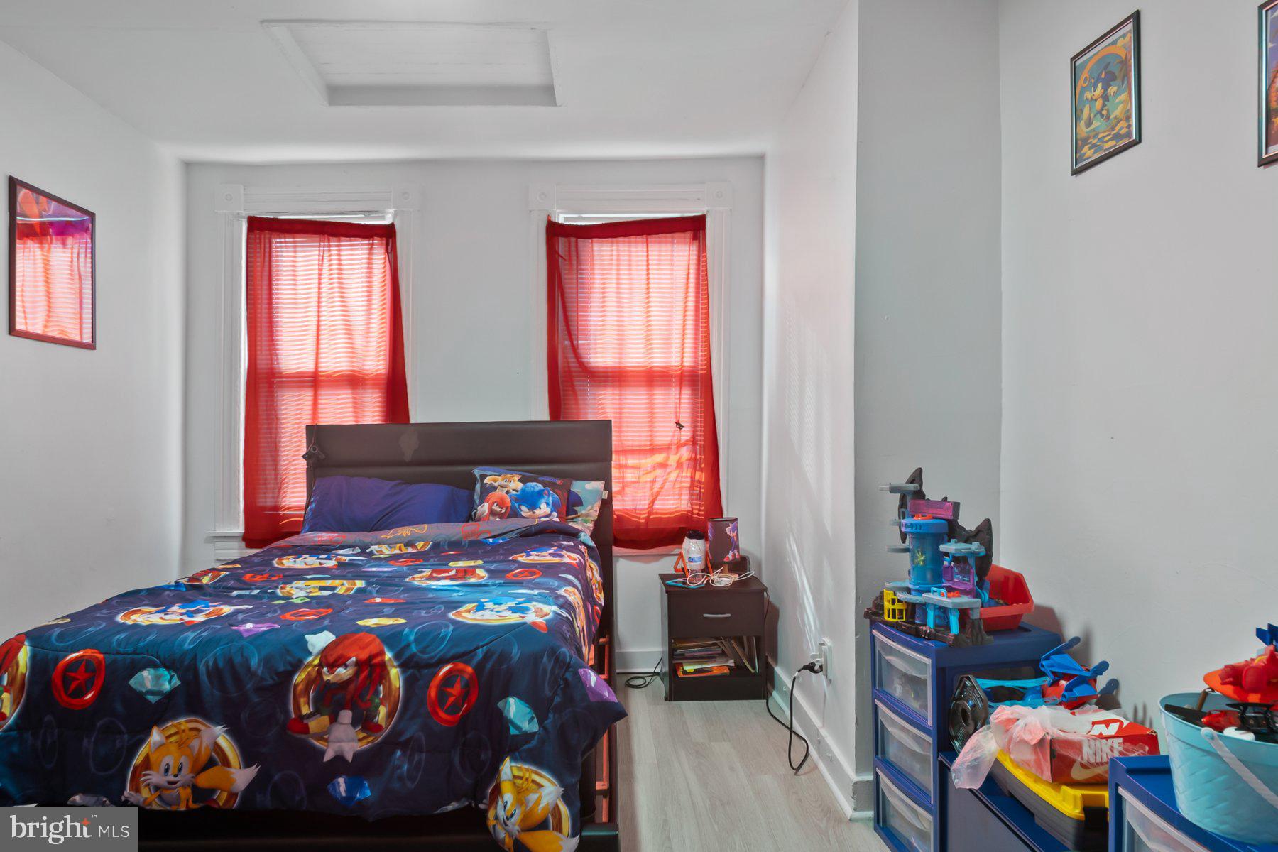 1659 Cliftview Avenue Baltimore, MD 21213 - Photo 12 of 25 a bedroom with a bed and a window