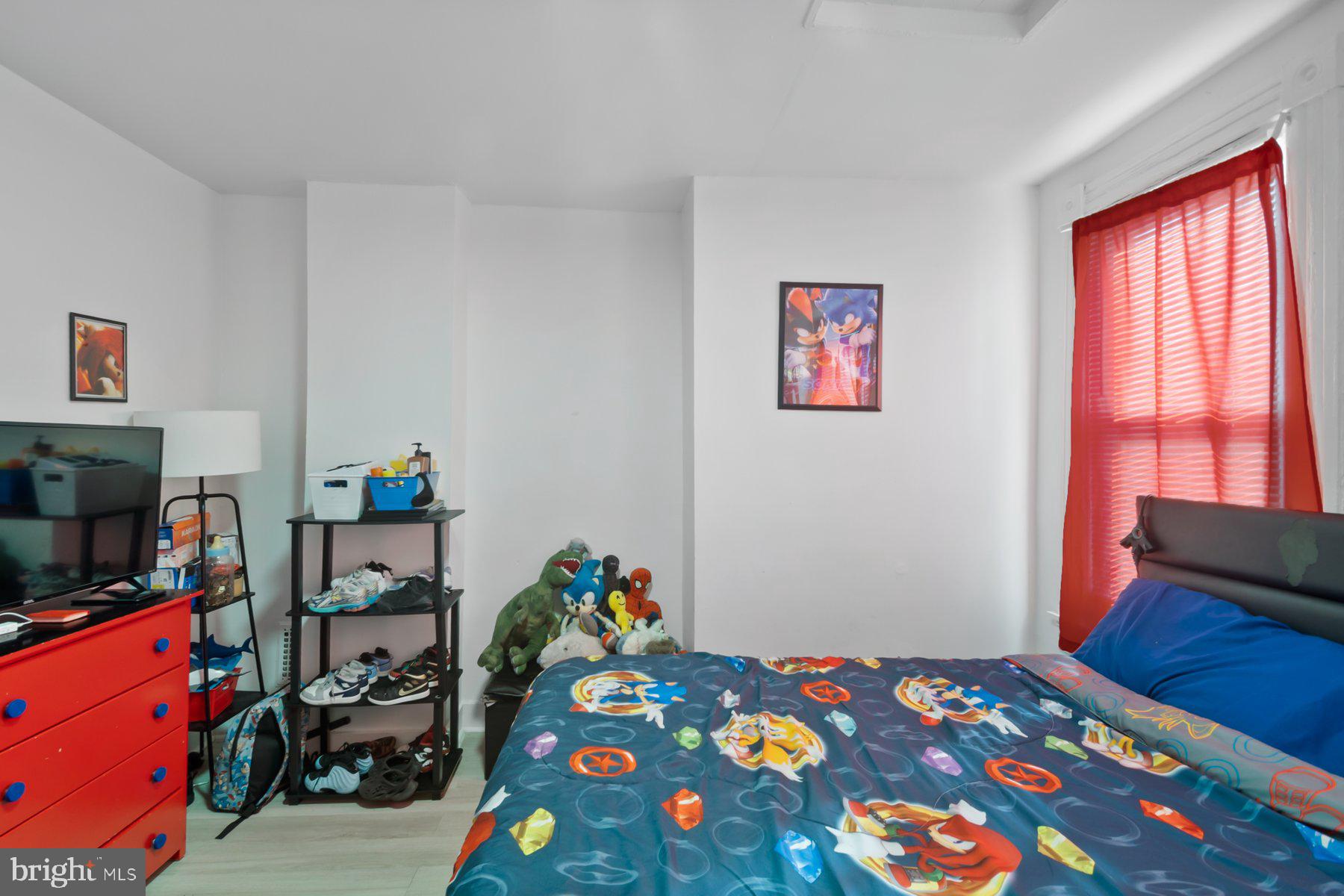 1659 Cliftview Avenue Baltimore, MD 21213 - Photo 13 of 25 a bedroom with a bed and a window