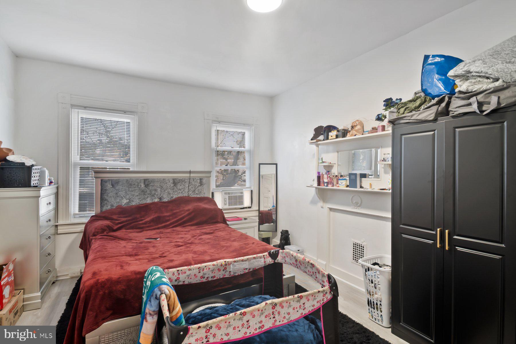 1659 Cliftview Avenue Baltimore, MD 21213 - Photo 17 of 25 a bedroom with a bed and a closet