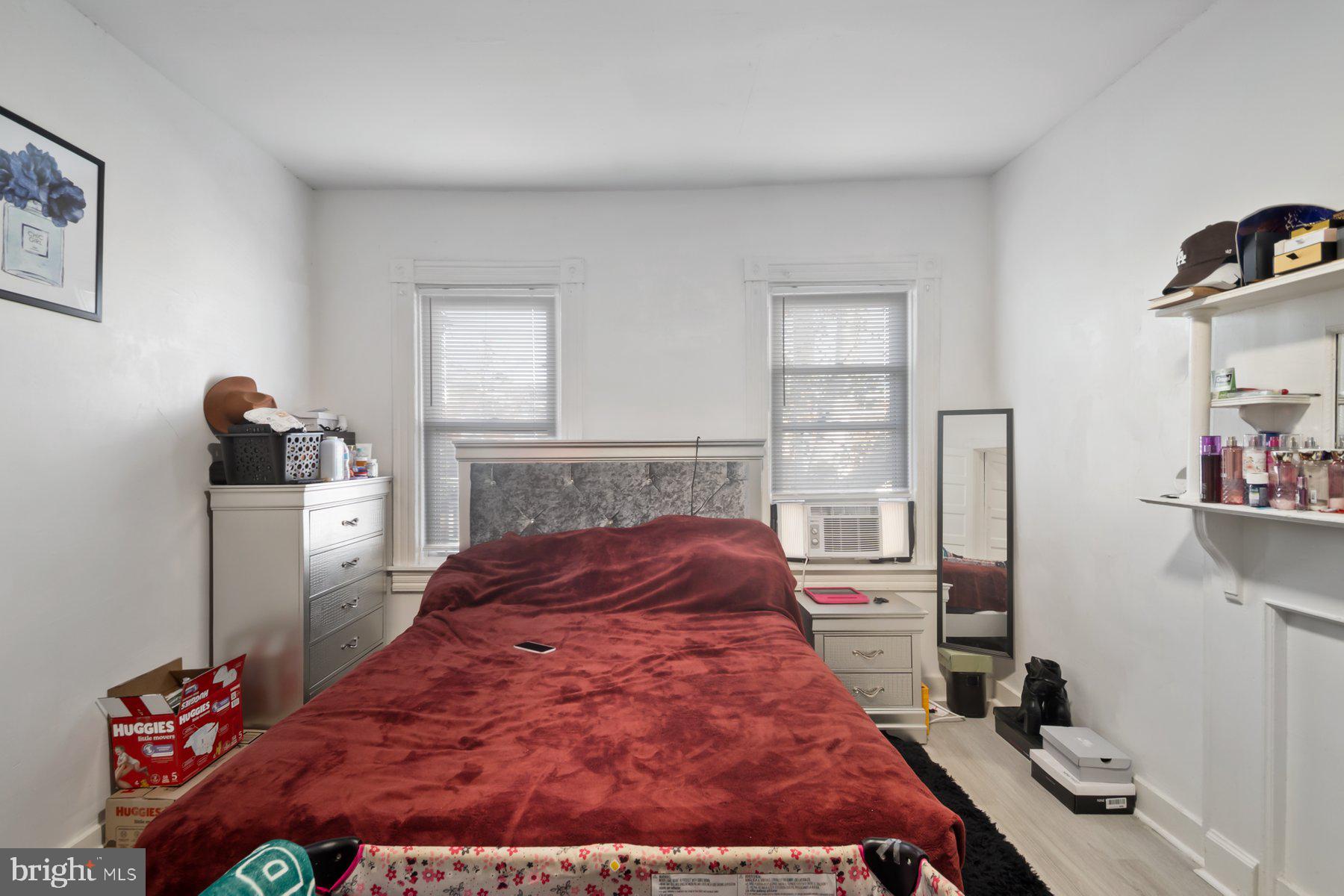 1659 Cliftview Avenue Baltimore, MD 21213 - Photo 18 of 25 a bed sitting in a bedroom next to a window