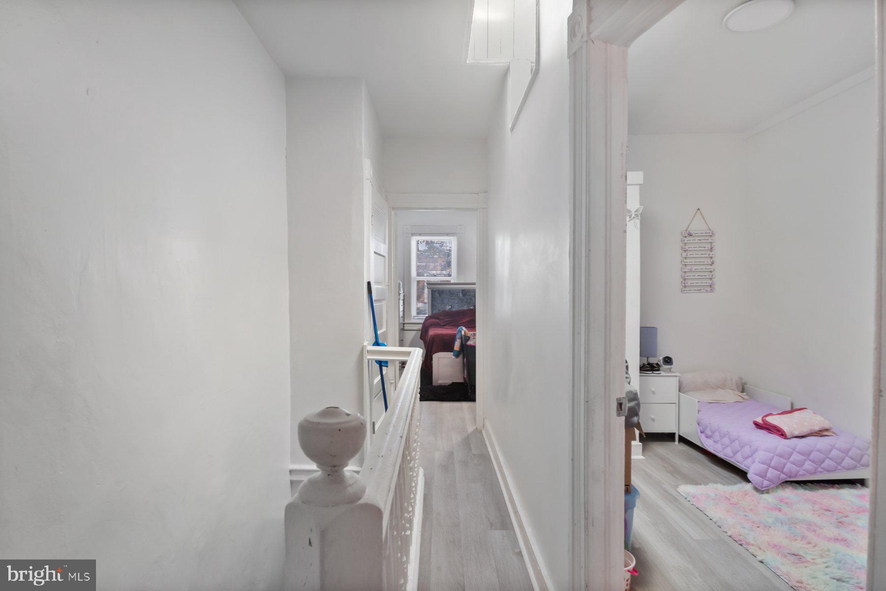 1659 Cliftview Avenue Baltimore, MD 21213 - Photo 21 of 25 a view of a hallway with a livingroom and painted walls