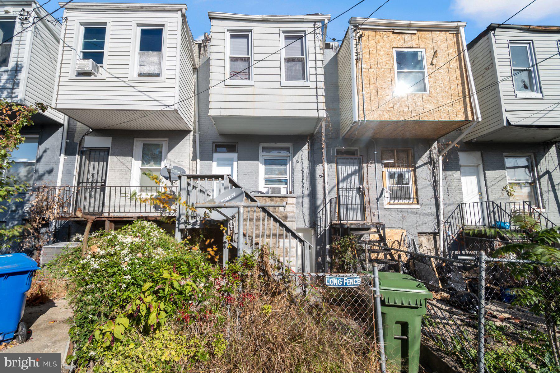 1659 Cliftview Avenue Baltimore, MD 21213 - Photo 24 of 25 a front view of a house with outdoor seating