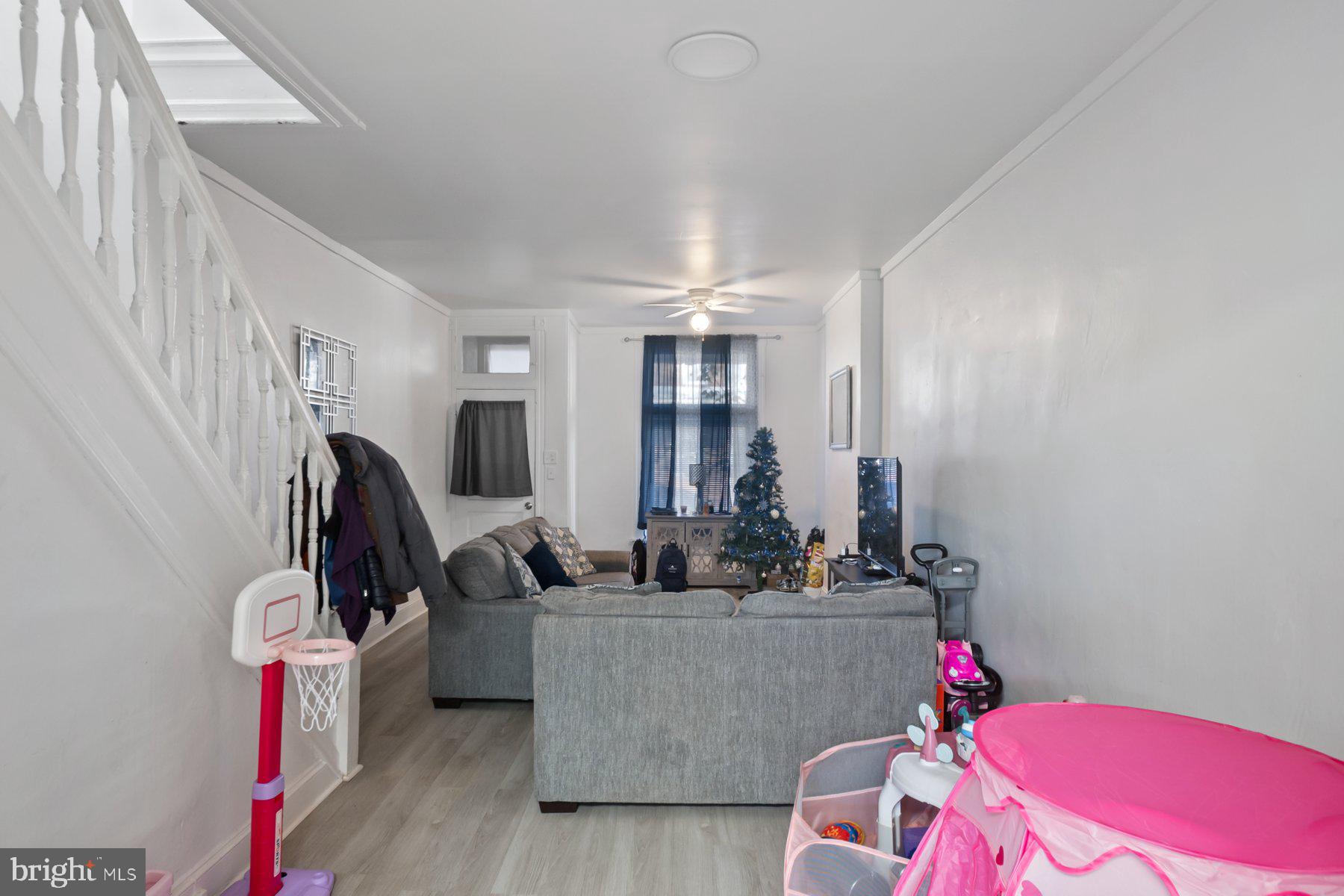 1659 Cliftview Avenue Baltimore, MD 21213 - Photo 7 of 25 a room with furniture and a potted plant