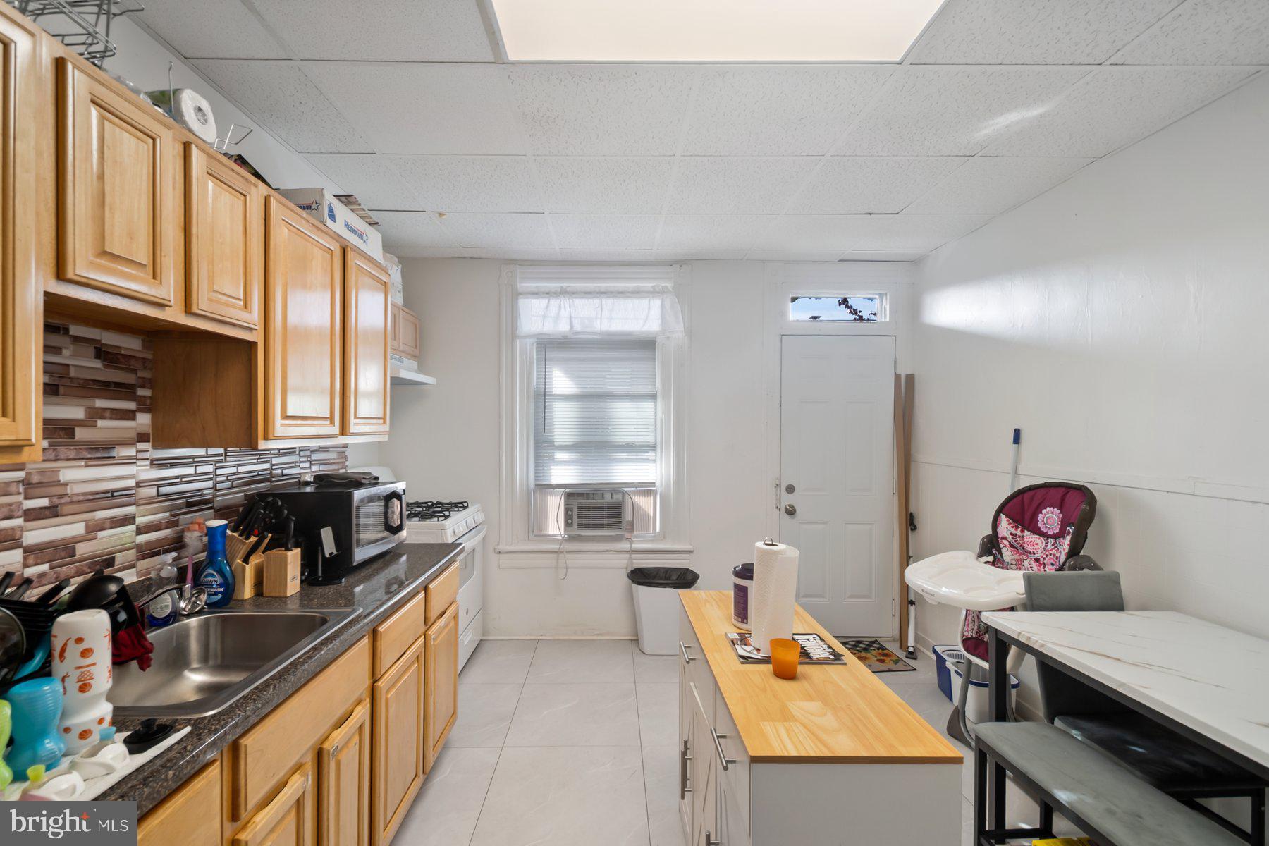 1659 Cliftview Avenue Baltimore, MD 21213 - Photo 9 of 25 a very nice looking dining room with a large window
