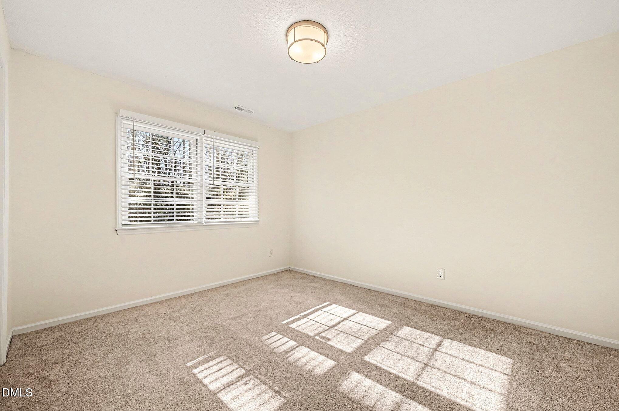 1920 White Plains Road Chapel Hill, NC 27517 - Photo 11 of 31 a view of an empty room with a window