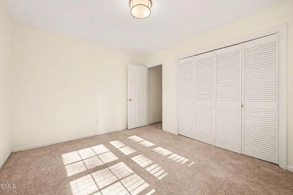 a kitchen with wooden floors and appliances