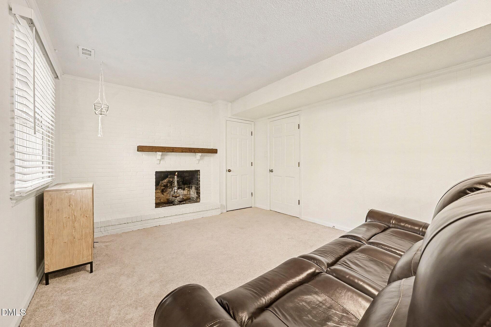 1920 White Plains Road Chapel Hill, NC 27517 - Photo 15 of 31 a view of a livingroom with furniture and a fireplace