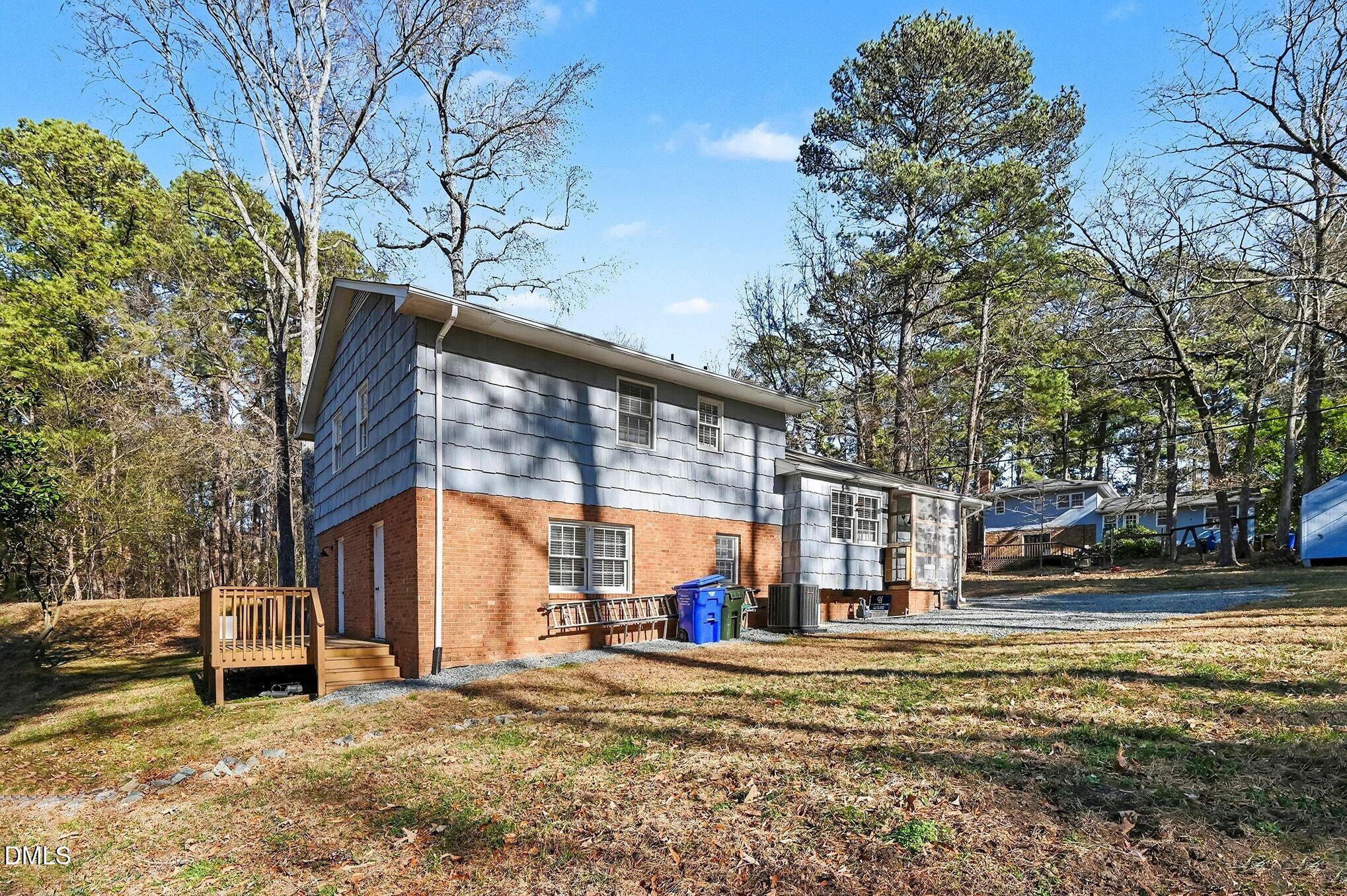 1920 White Plains Road Chapel Hill, NC 27517 - Photo 23 of 31 a view of a house with a yard