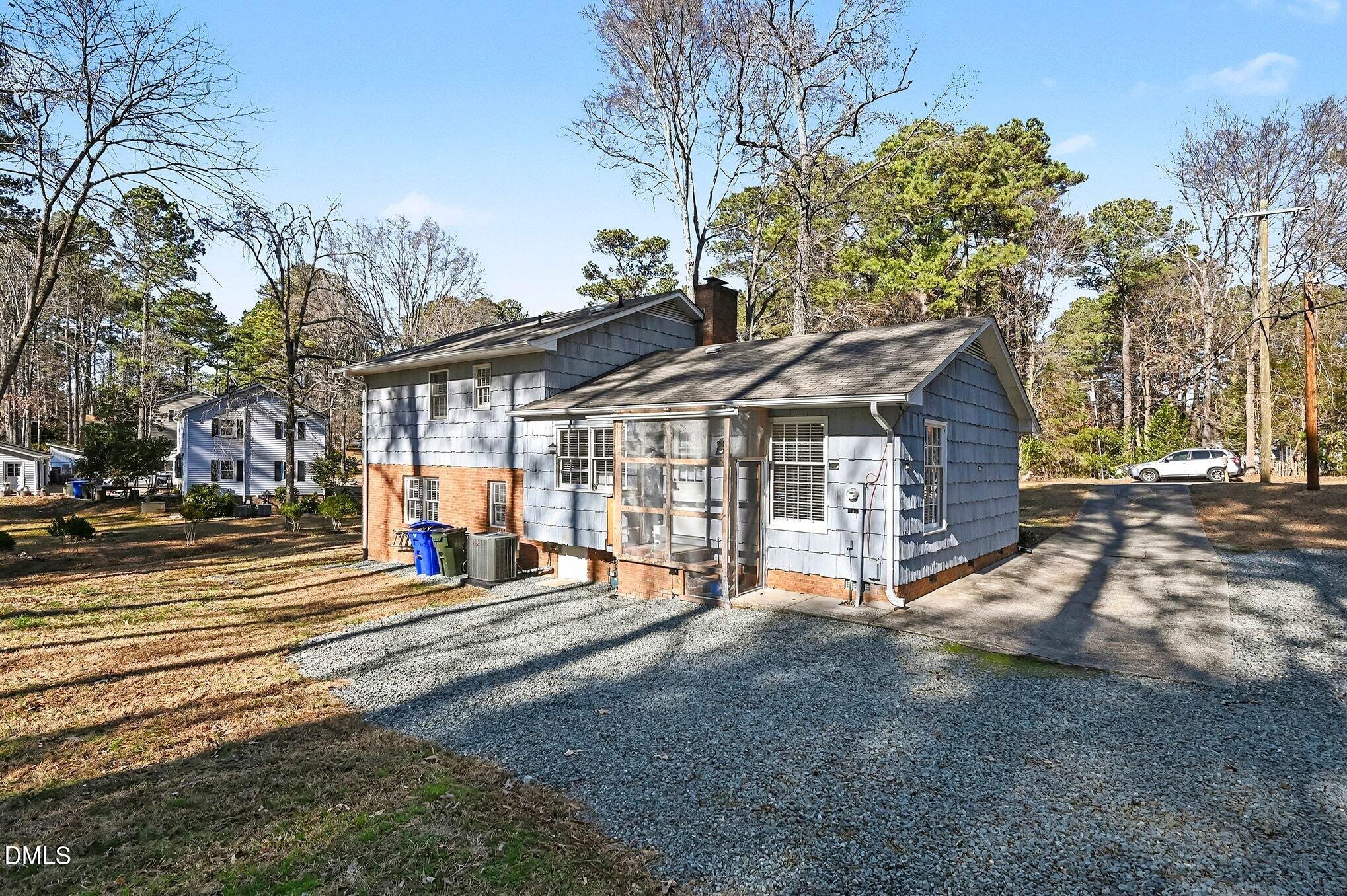 1920 White Plains Road Chapel Hill, NC 27517 - Photo 25 of 31 a view of a house with a yard