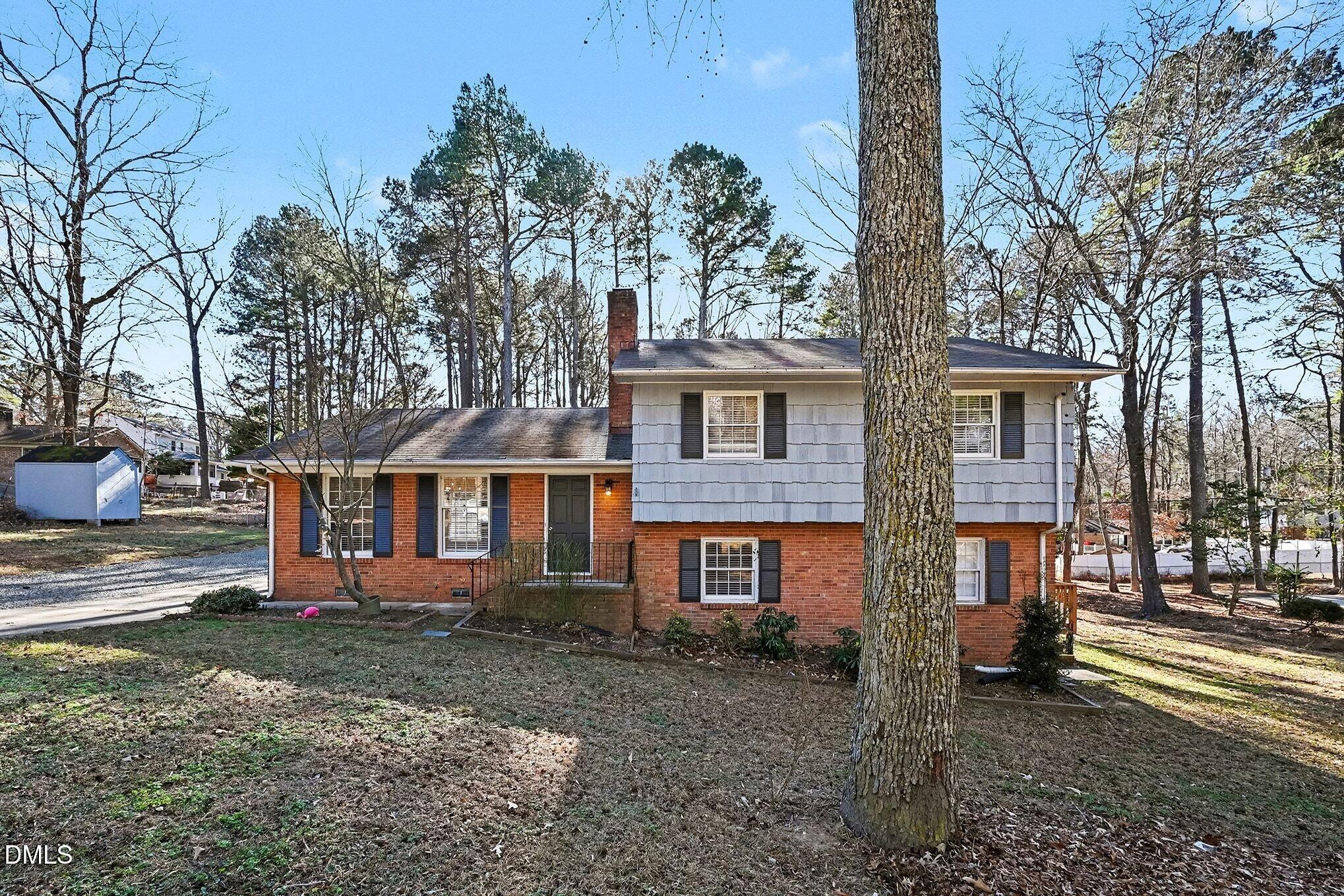 1920 White Plains Road Chapel Hill, NC 27517 - Photo 2 of 31 a front view of a house with a yard