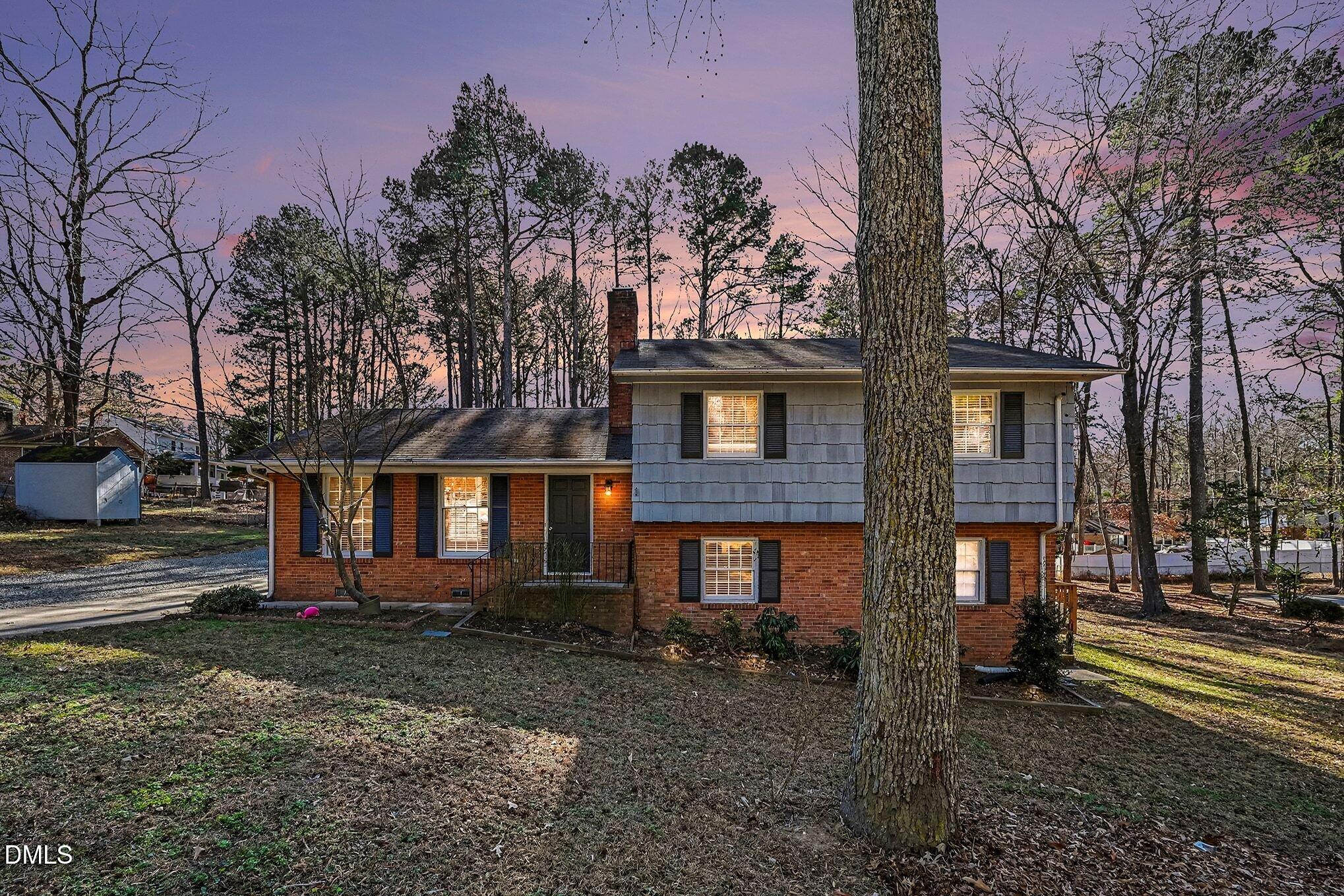 1920 White Plains Road Chapel Hill, NC 27517 - Photo 28 of 31 a front view of a house with a yard