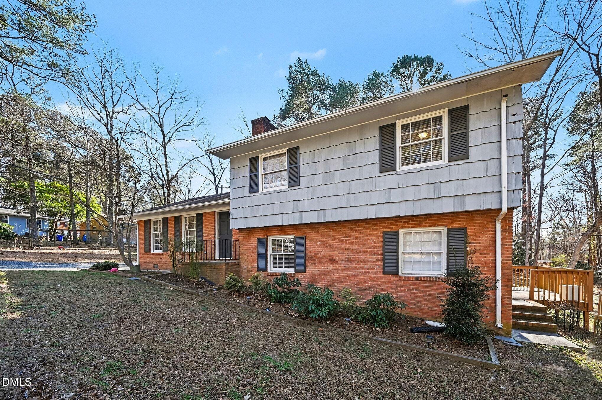 1920 White Plains Road Chapel Hill, NC 27517 - Photo 3 of 31 a front view of a house with garden