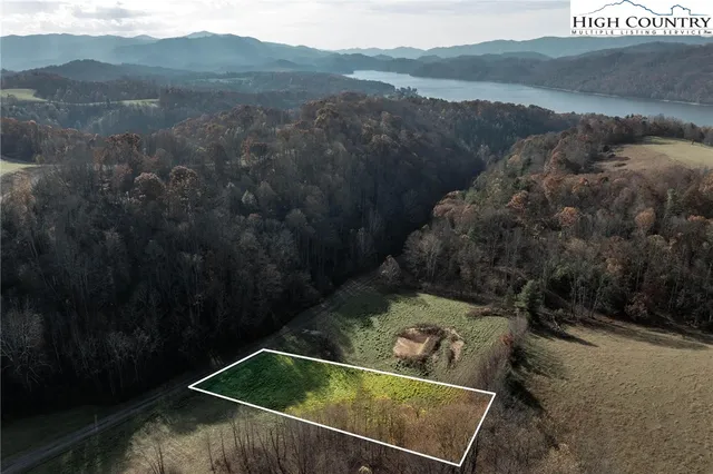 a view of a small pool with a yard