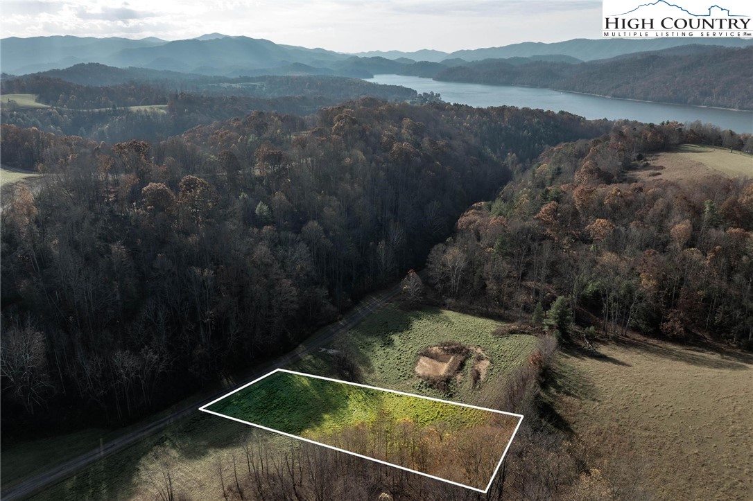 a view of a small pool with a yard