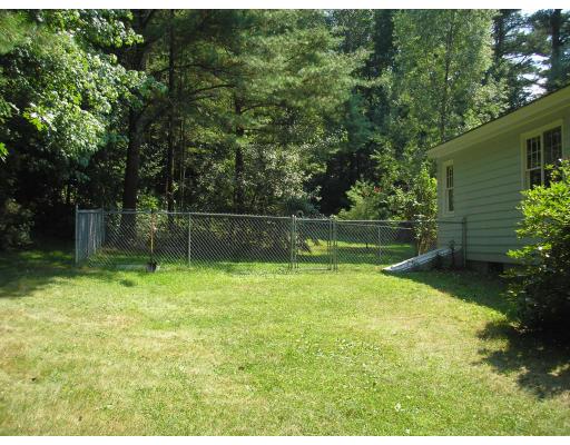 39 Long Hill Road Holland, MA 01521 - Photo 13 of 22 a view of a backyard with a garden