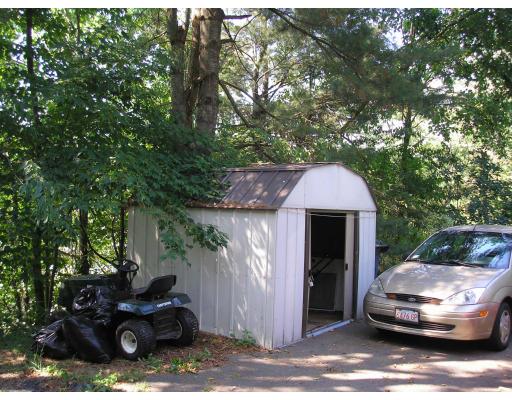 39 Long Hill Road Holland, MA 01521 - Photo 20 of 22 a car parked in front of a house