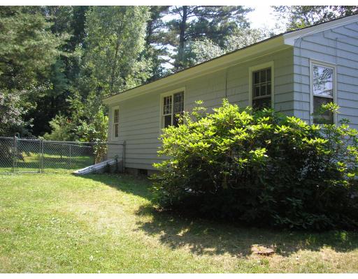 39 Long Hill Road Holland, MA 01521 - Photo 2 of 22 a backyard of a house with lots of green space