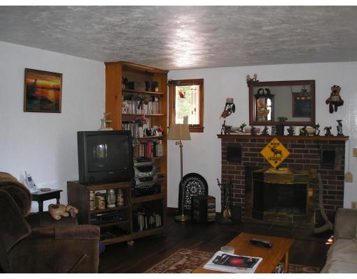 39 Long Hill Road Holland, MA 01521 - Photo 22 of 22 a living room with furniture a fireplace and a flat screen tv