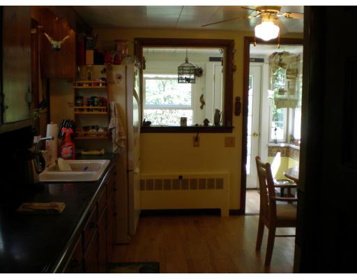 39 Long Hill Road Holland, MA 01521 - Photo 6 of 22 a kitchen with kitchen island a counter top space appliances and a window