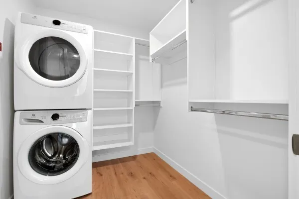 a view of a hallway with washer and dryer