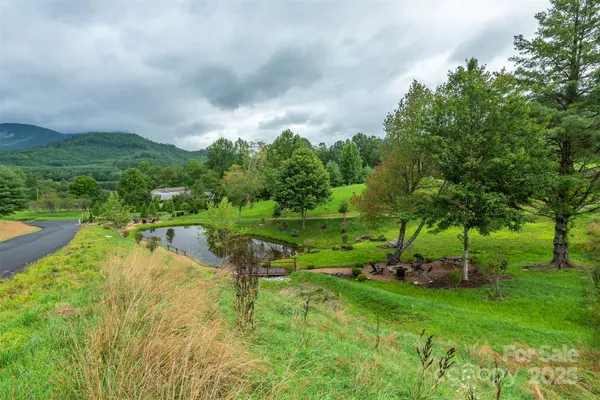 a view of a lake with a yard