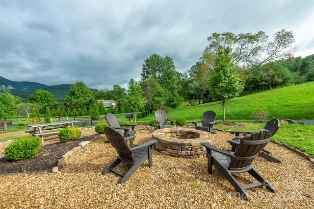 a backyard of a house with outdoor seating