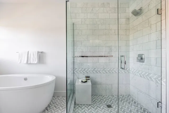 a bathroom with a bathtub and shower