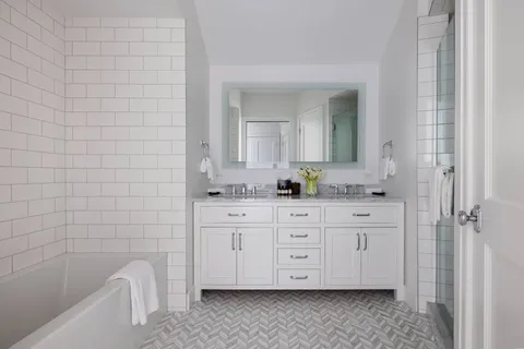 a bathroom with a sink a vanity and mirror