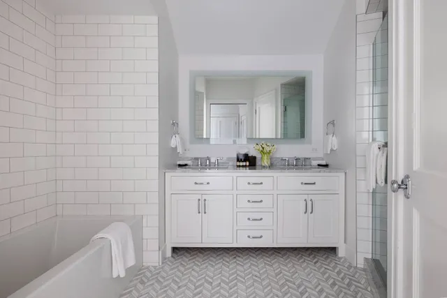 a bathroom with a sink a vanity and mirror