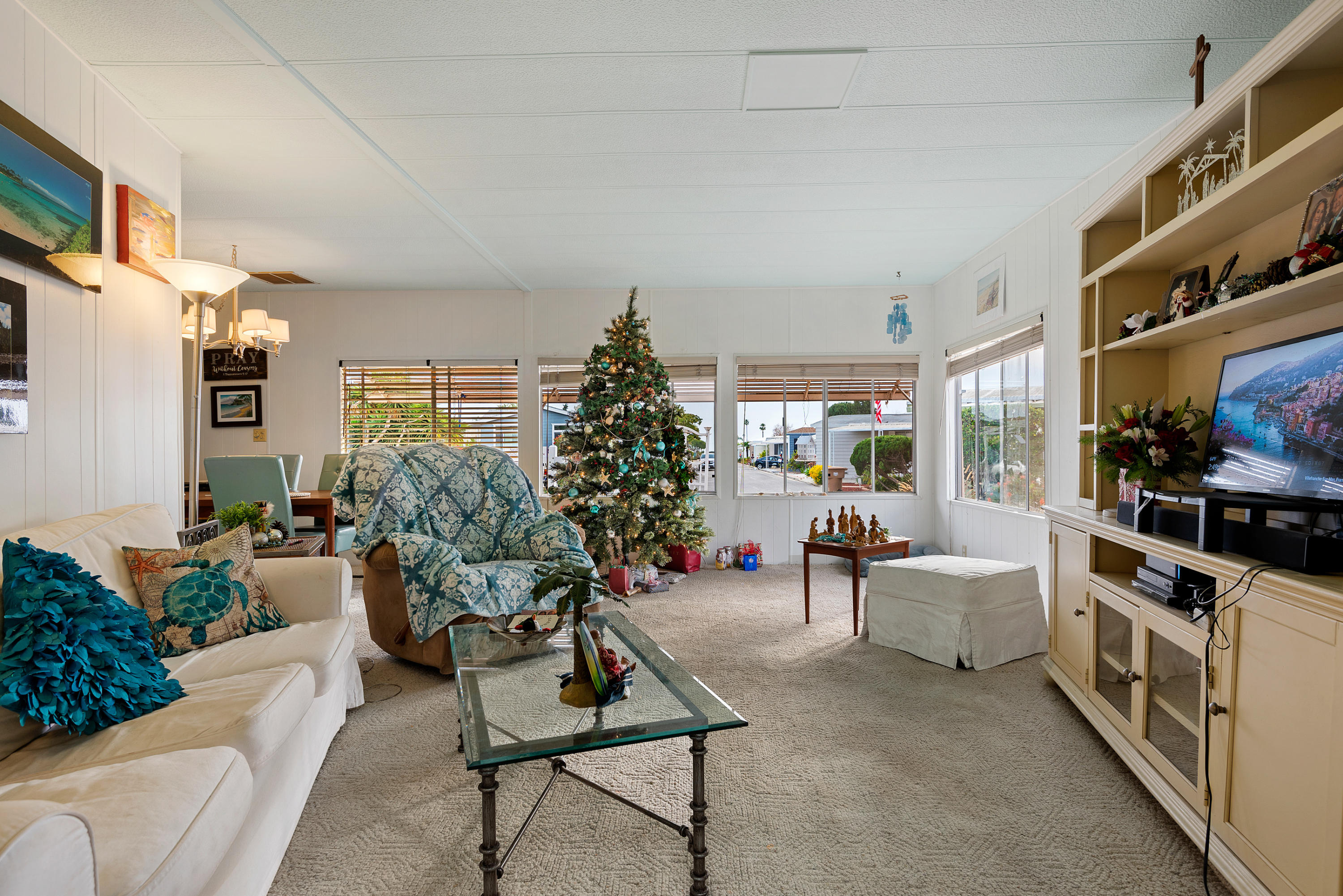 6180 Via Real, Unit 21 Carpinteria, CA 93013 - Photo 3 of 14 a living room with furniture and a flat screen tv